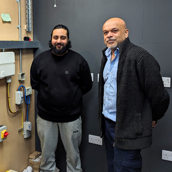 A Logic4training electrical student with their trainer after completing the Part P course