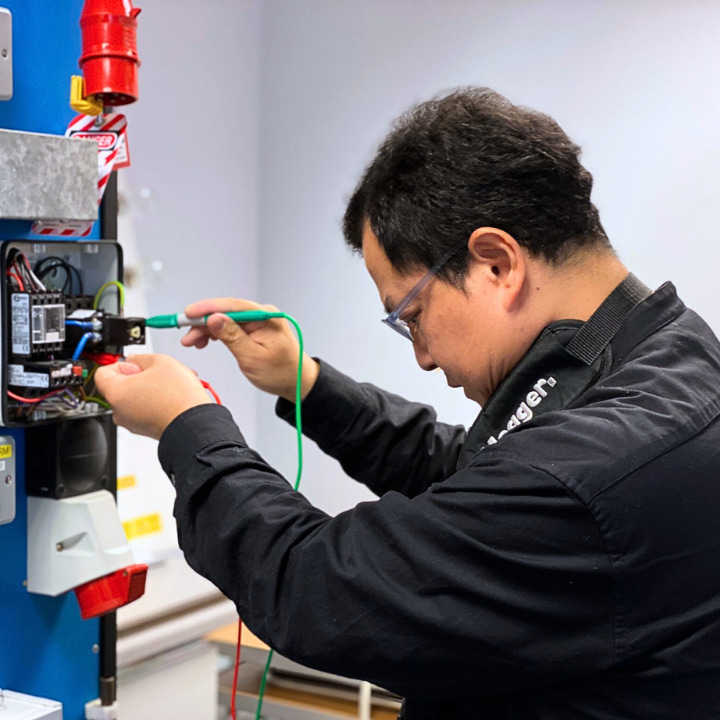 A Logic4training student carrying out the initial inspection and testing process