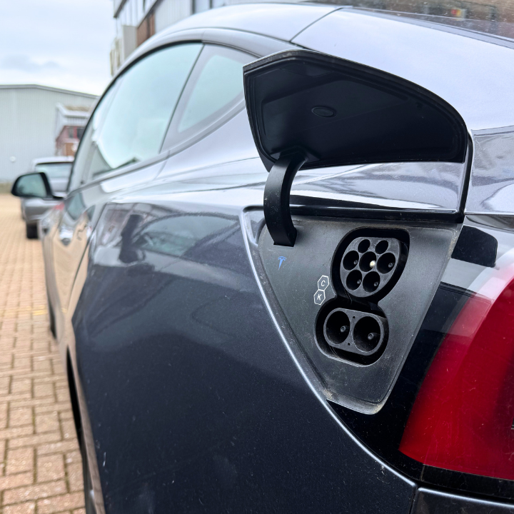 A electric vehicle with it's charge port open