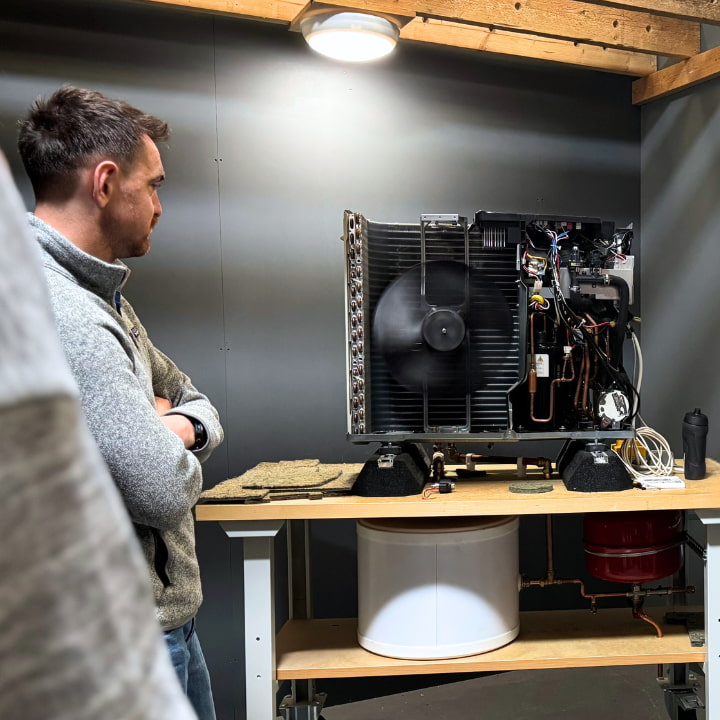 A person completing their air source heat pump training course at Logic4training