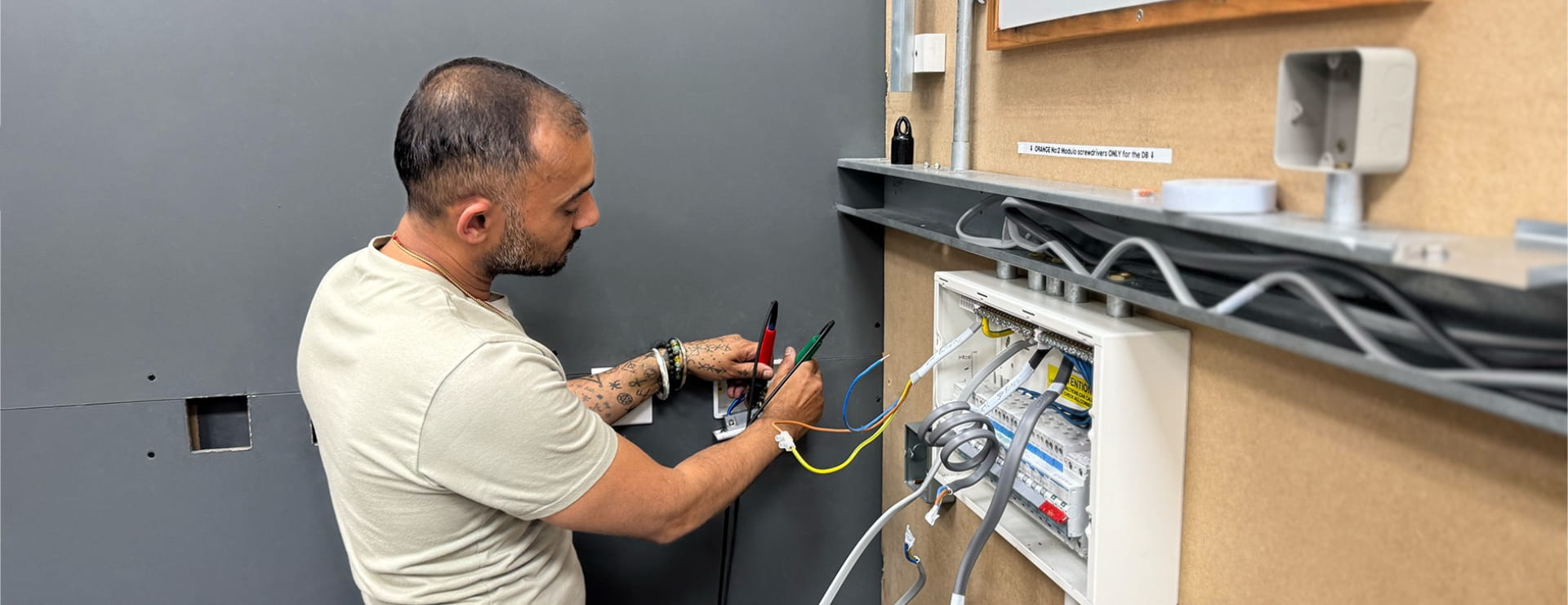 Electrical student carrying out test training to work towards joining a competent person scheme