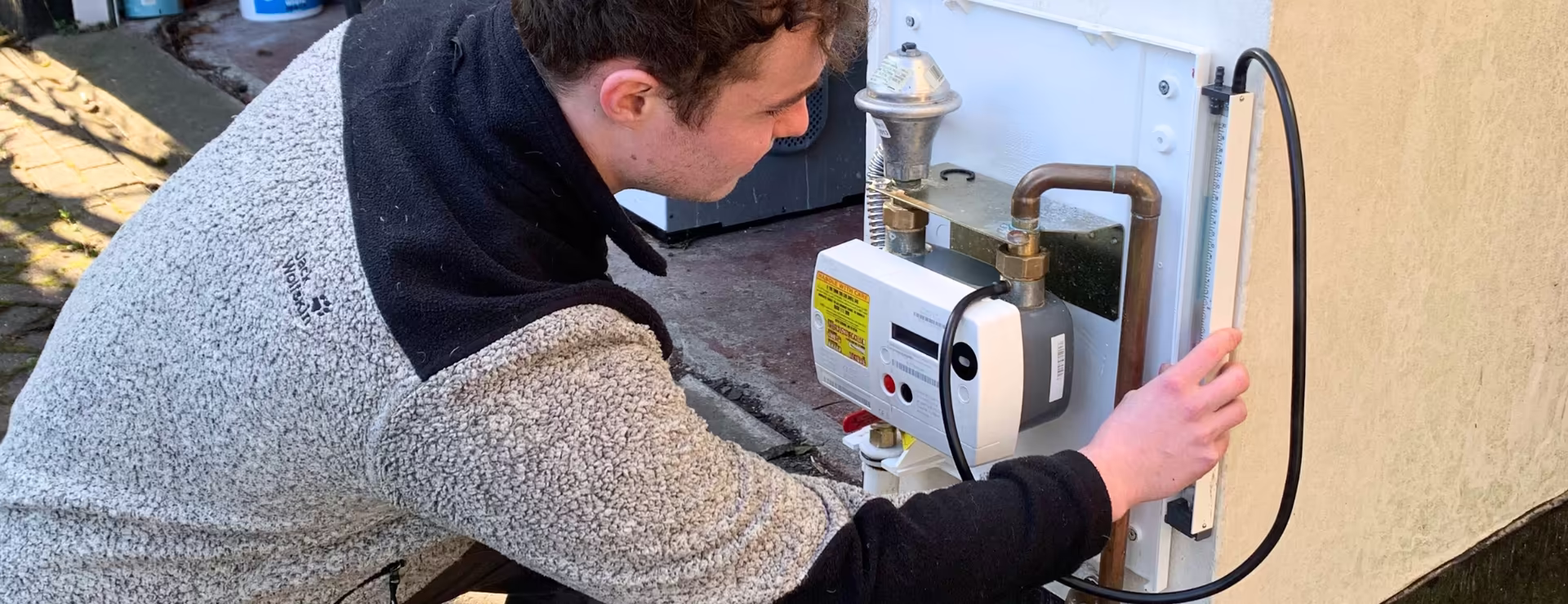 Gas student carrying out a tightness test as part of their training to become a qualified gas engineer