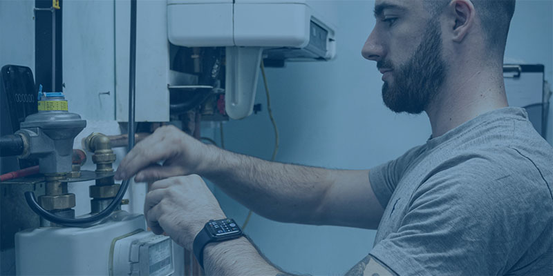 close up of trainee working on a gas metre