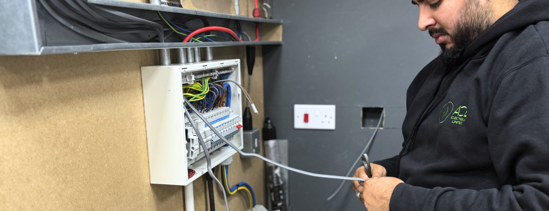 Trainee electrician completing their electrician course