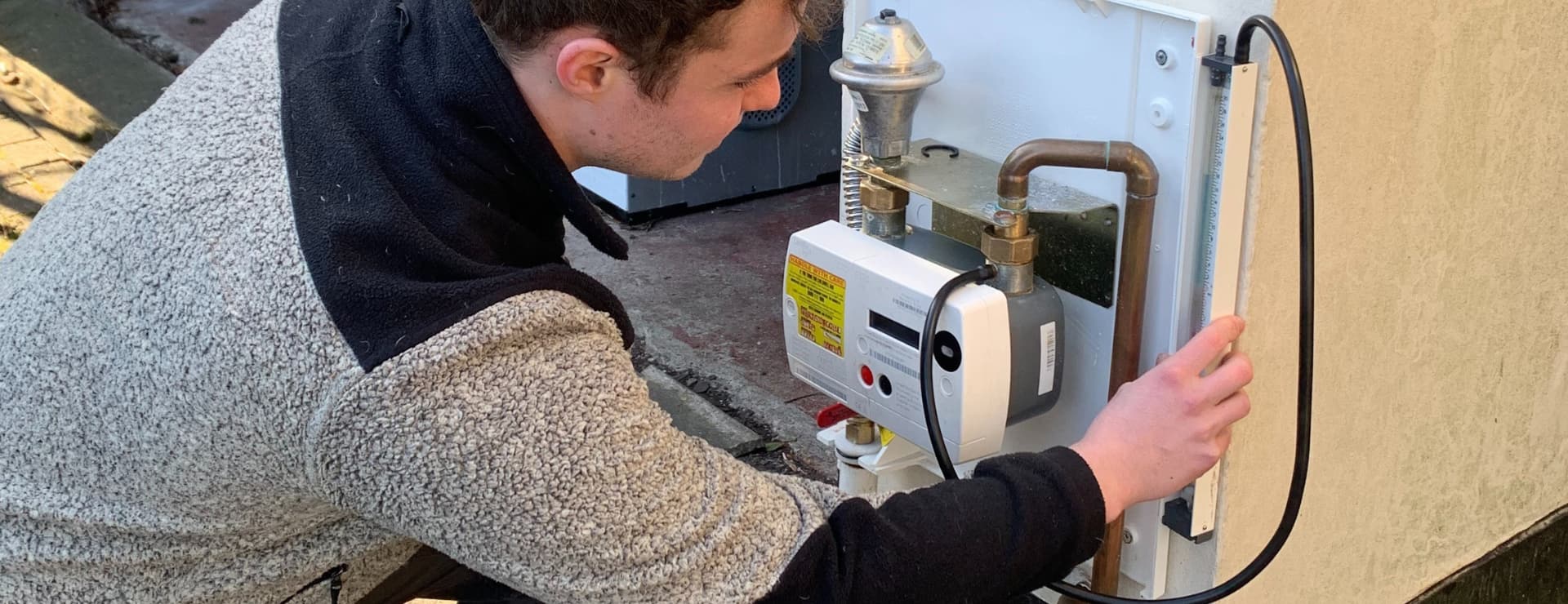 a gas student doing a tightness test to complete their training complete their 8 week training course