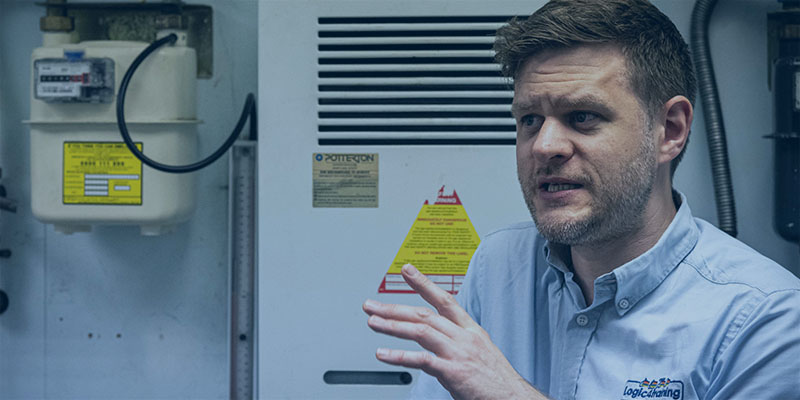 man in front of gas meter