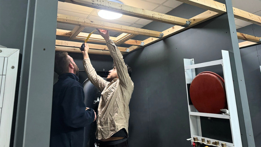 A Logic4training essential site skills trainer teaching a student how to measure a ceiling void