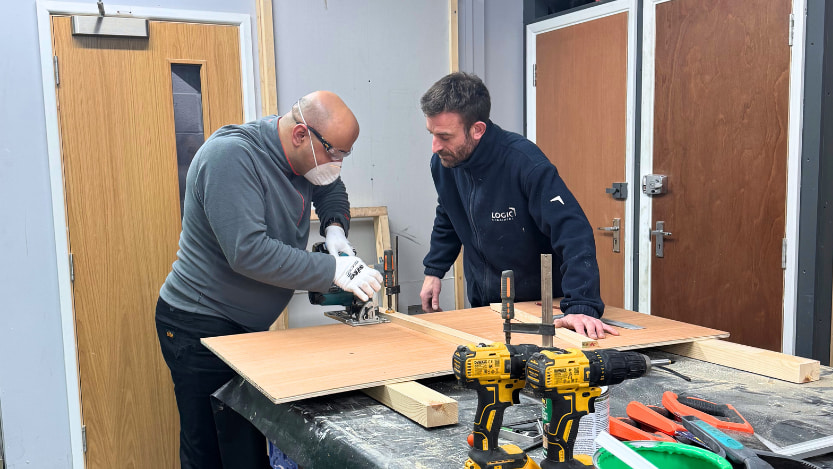 A Logic4training essential site skills trainer teaching a student how to use a saw safely