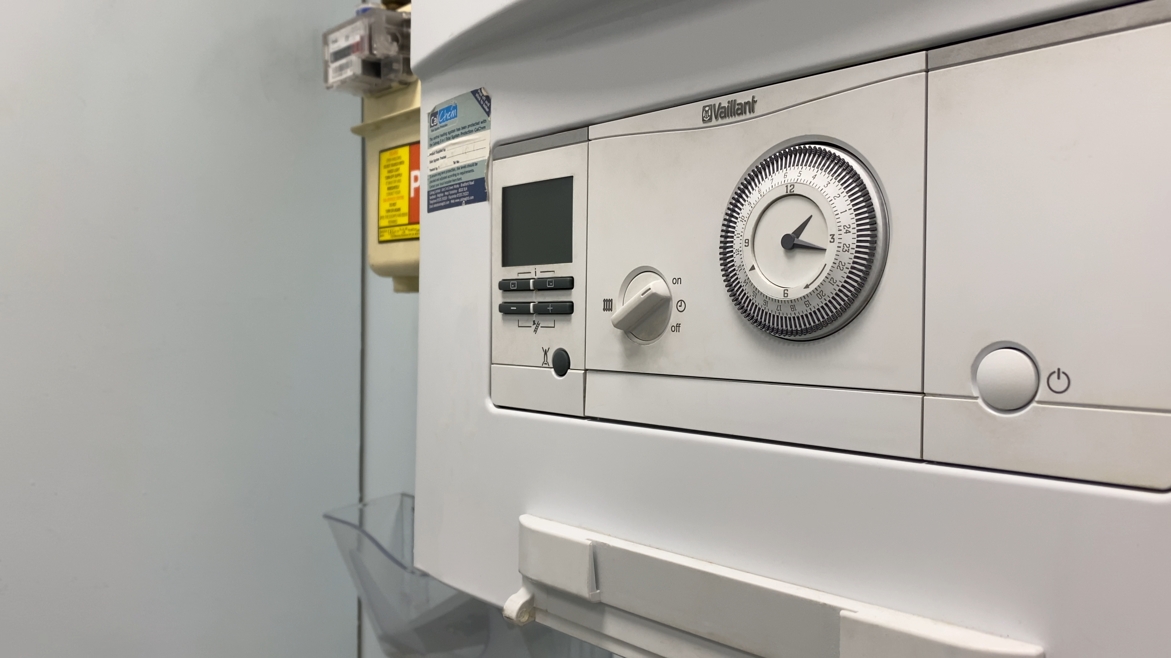 a photo of a boiler on a white wall