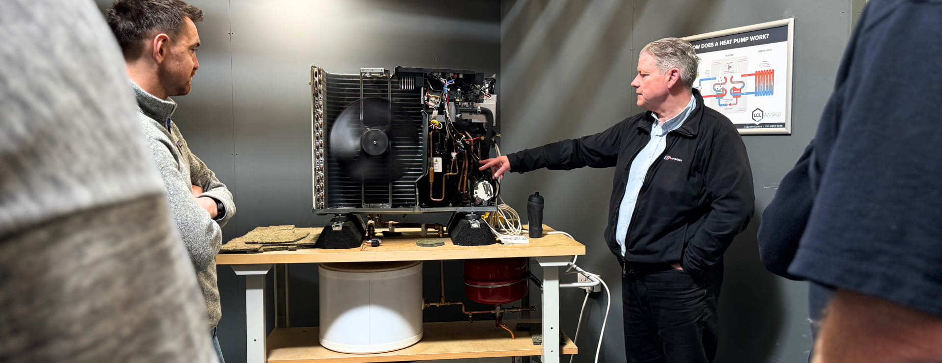 Heat pump trainer teaching the heat pump students how it works so they can complete their training, become qualified and then make more money