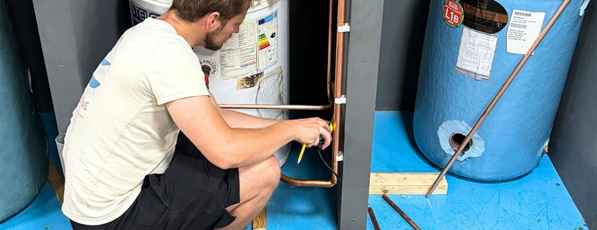 trades student working on a heating system