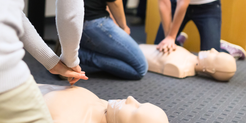 Logic4training candidates performing CPR on their first aid at work course
