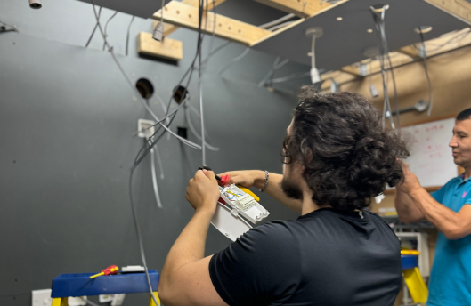 2 trainee tradespeople learning trade skills