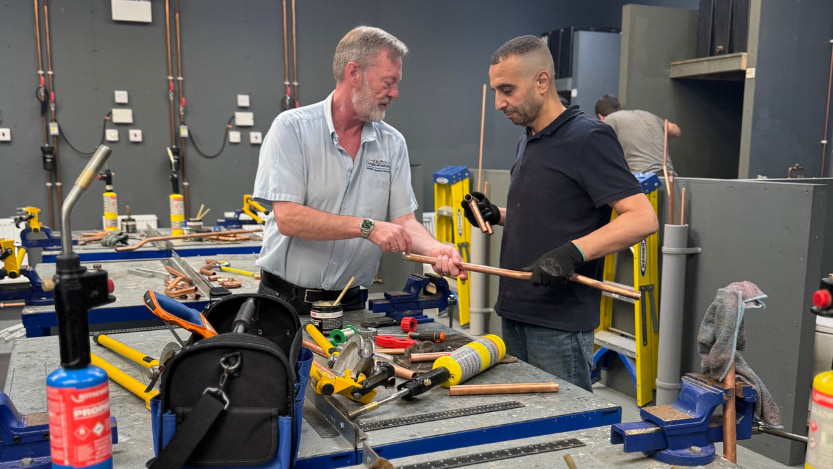 plumbing trainer and student