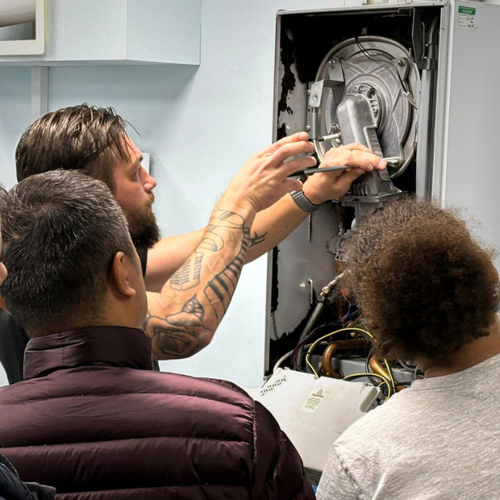 gas students working on a boiler