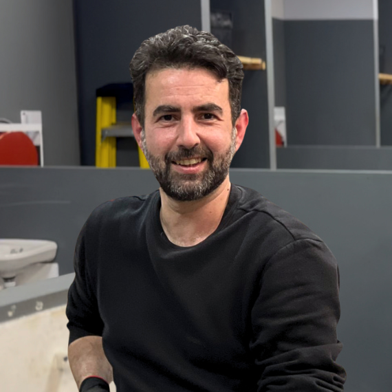 man smiling in gas workshop