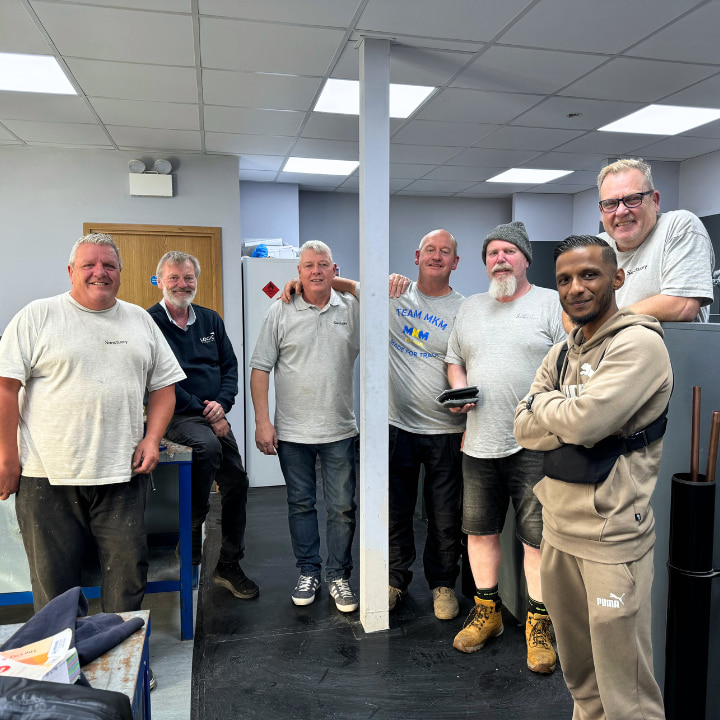 men in a plumbing workshop