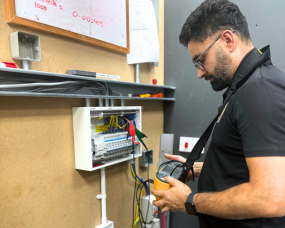 person testing an electrical system