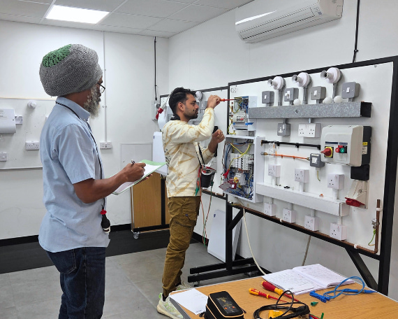 A Logic4training electrical trainer observing the electrical student carrying out initial inspection and testing