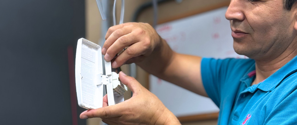 electrical student working on a light's junction box