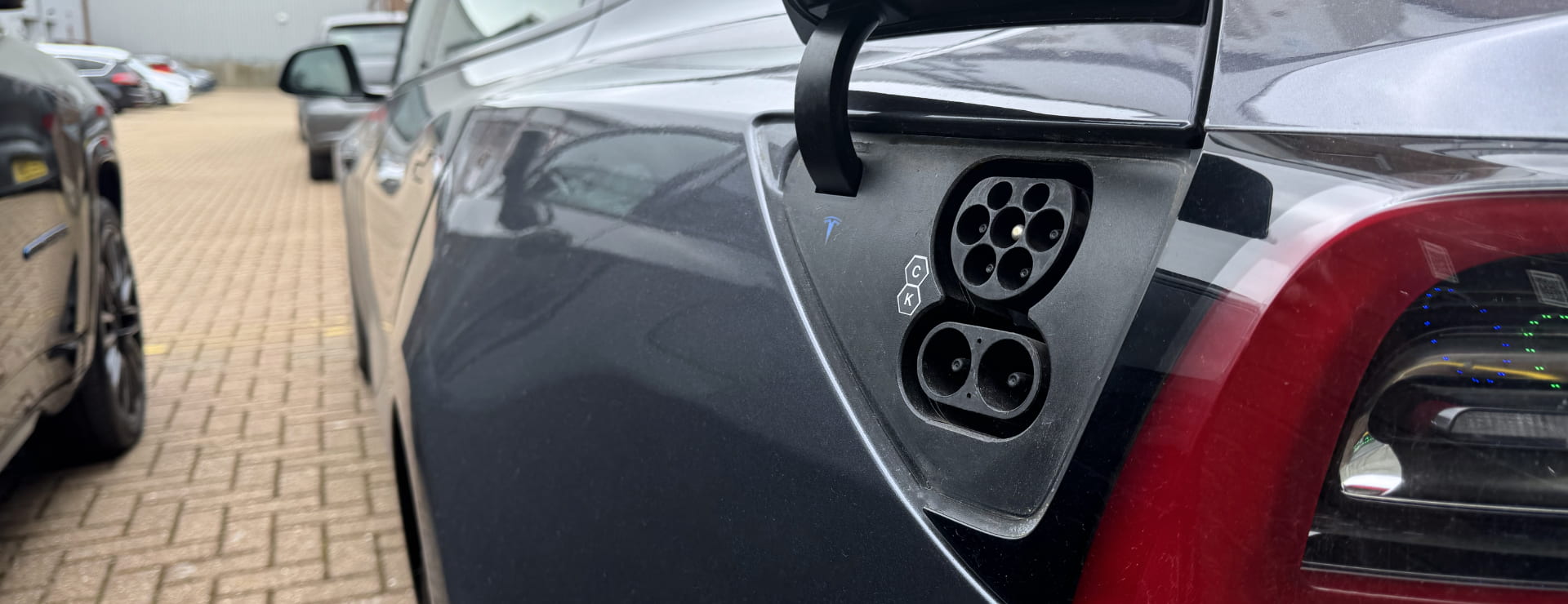 An electric charging port on a car