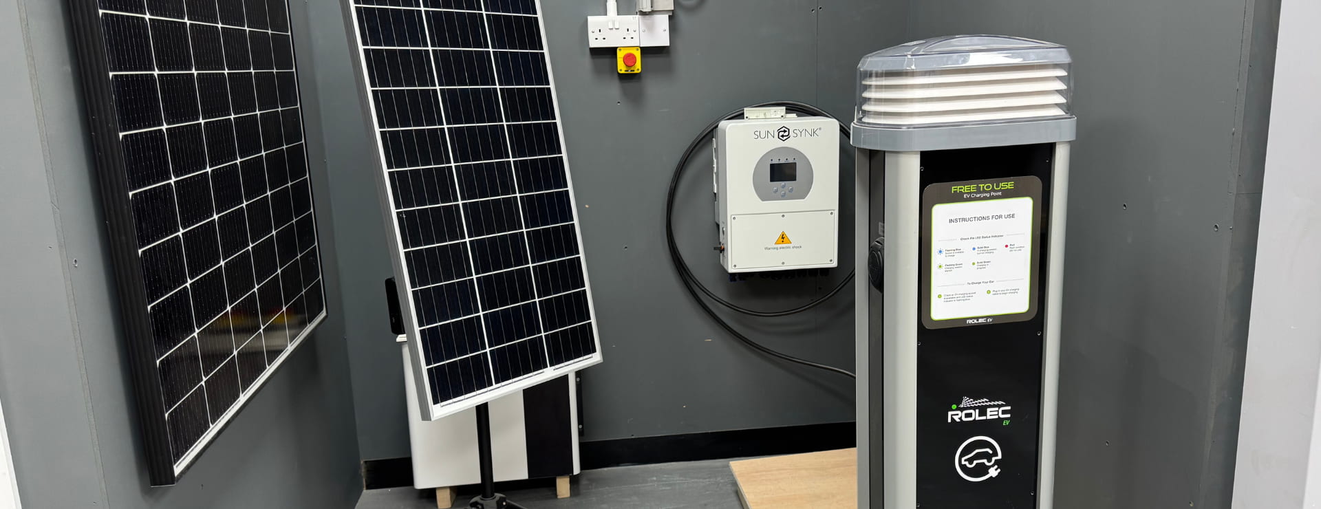 An ev charger, solar panels and battery storage unit. All of which can be part of an ev charger installation and infrastructure