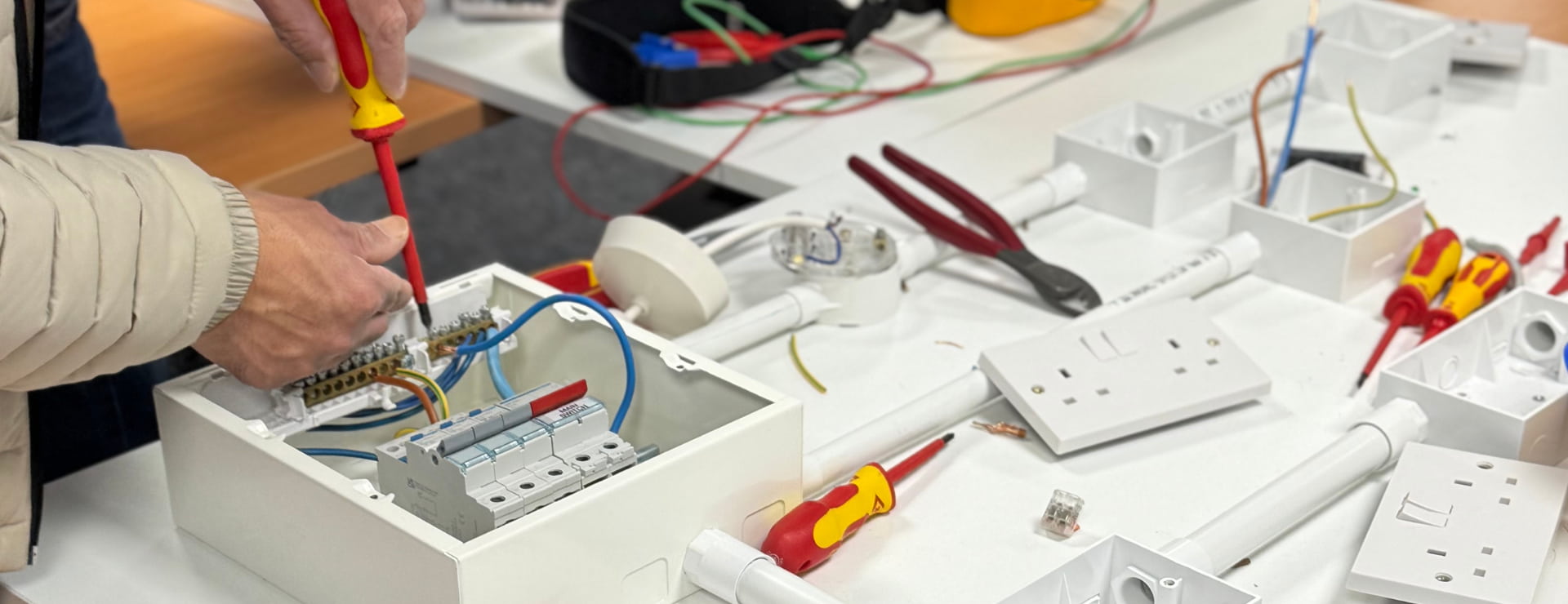 Electrical student working in attach electrical wires