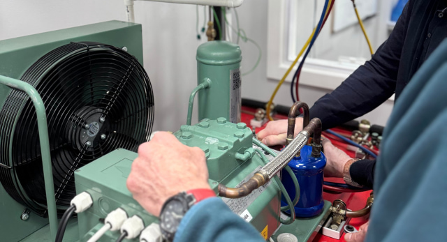 F-Gas trainees working on a air conditioning unit