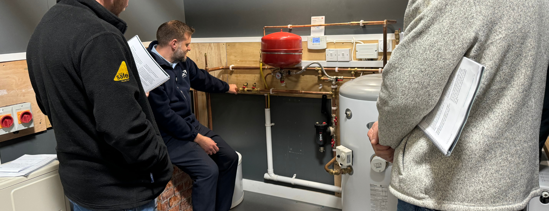 air source heat pump class looking at the pipe work needed for air source heat pumps