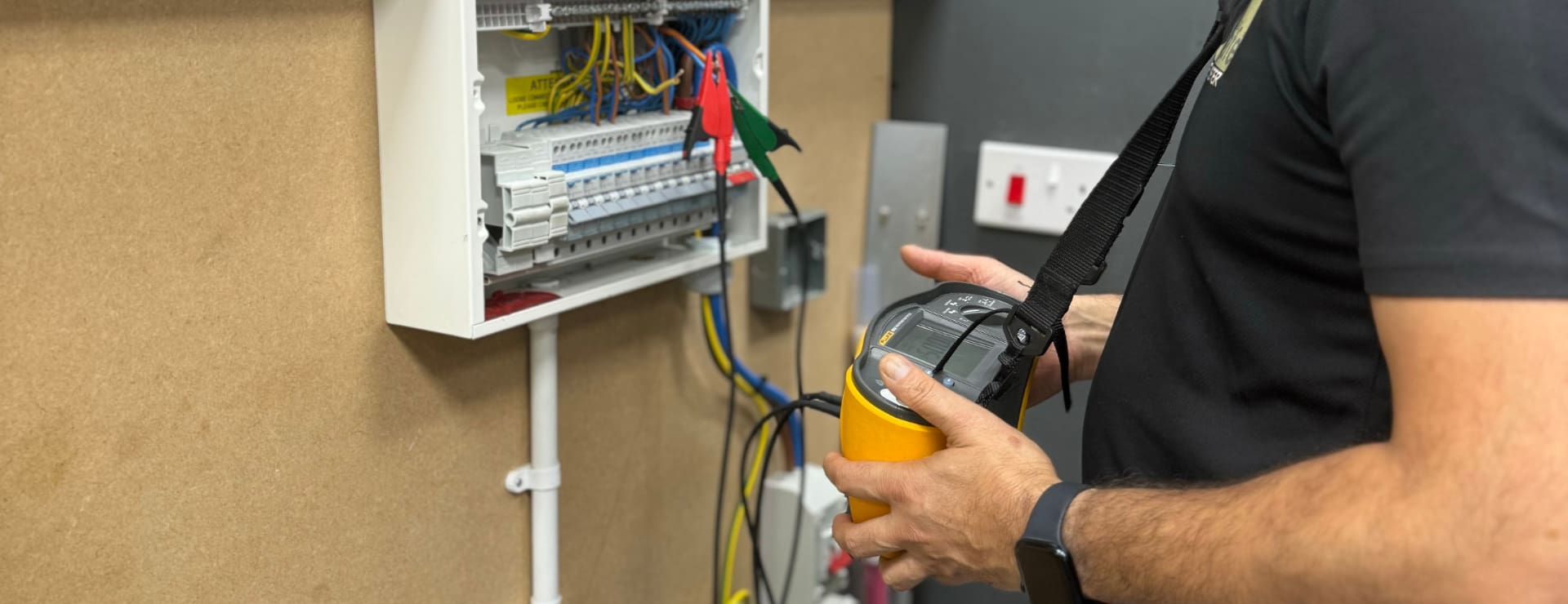 an electrical student completing periodic inspection and testing