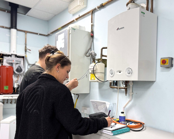 two gas students completing their gas training course