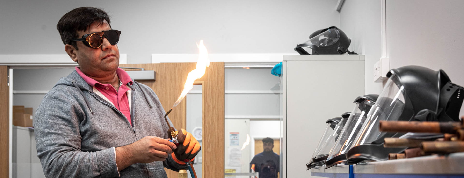 an FGas student reducing the flame to prevent and incident that leads to RIDDOR reporting