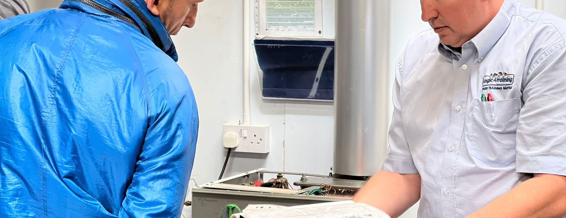 a trainer going through the risks of injury whilst working on appliances that may lead to RIDDOR reporting