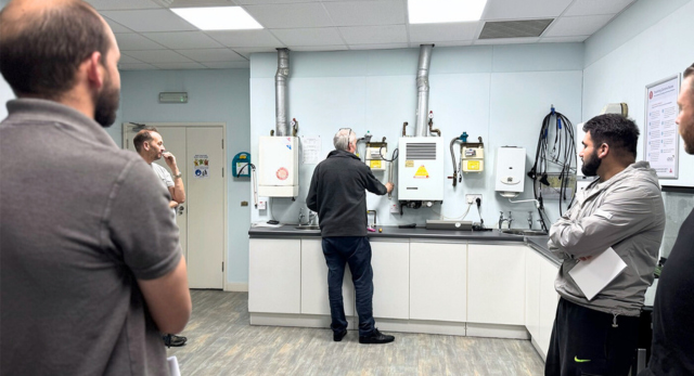 gas trainer explaining to students what challenges they may face as a trades business in the uk