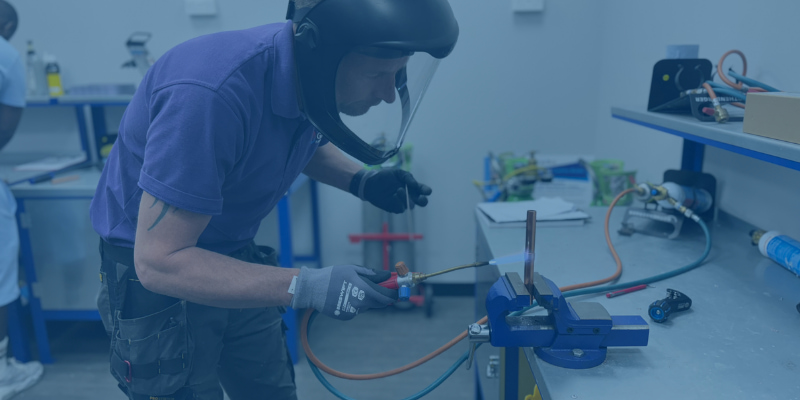 person brazing some copper pipework on their Refrigeration and AC Pipework and Brazing Training Course