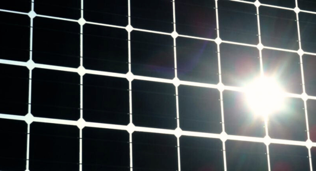 a solar panel that has been installed on a flat-roof pv mounting system