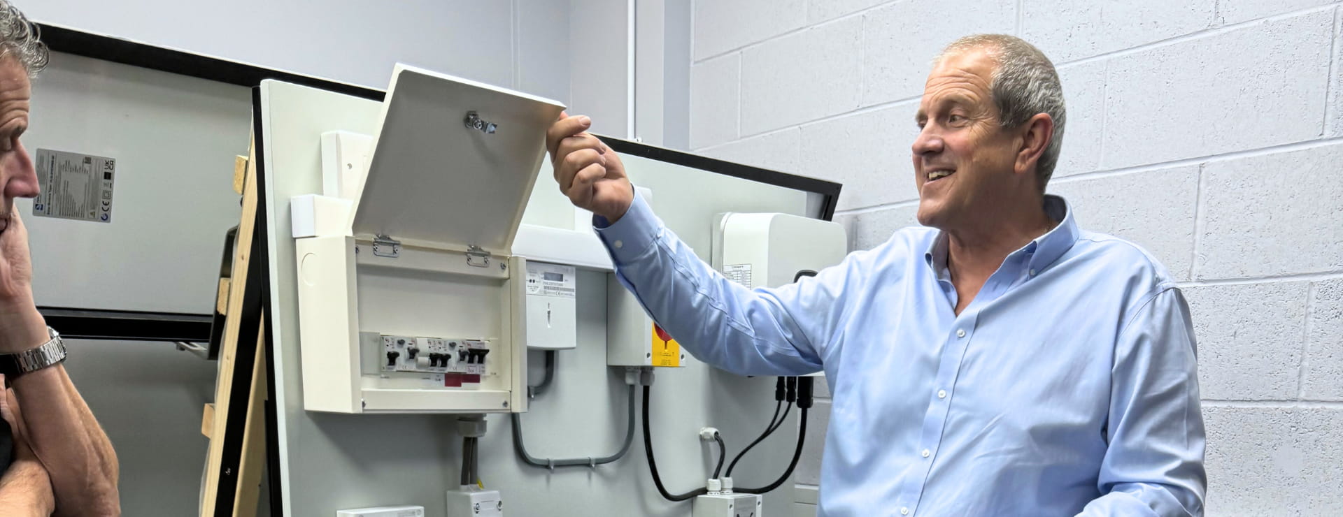 a solar pv trainer teaching a class about the components of a solar pv system