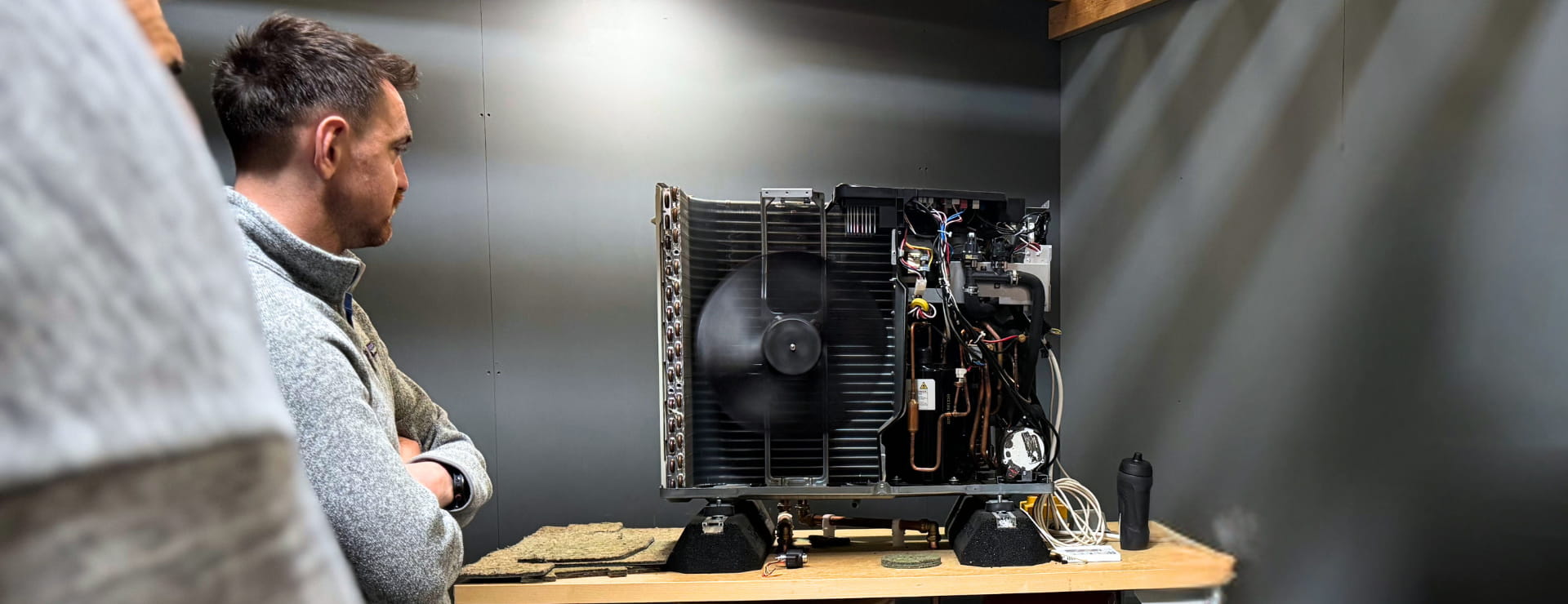 a student learning to become a heat pump installer