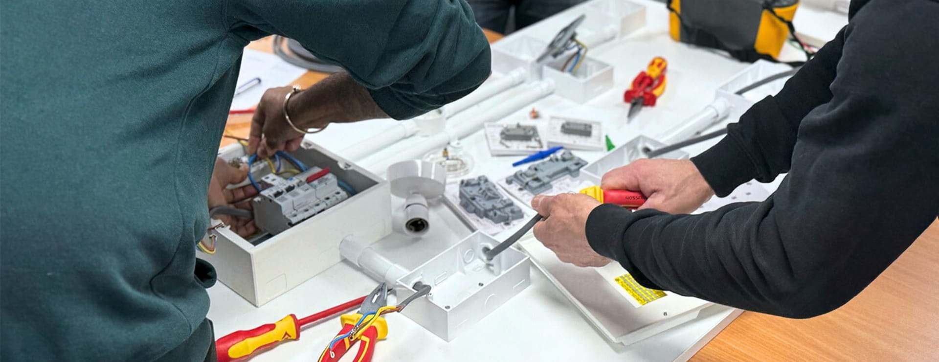 Electrical students completing part of their retraining to become electricians