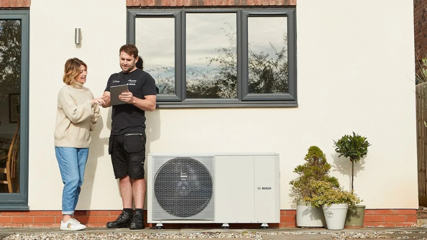 Alto Energy engineer explaining the Start at Home Scheme to their customer