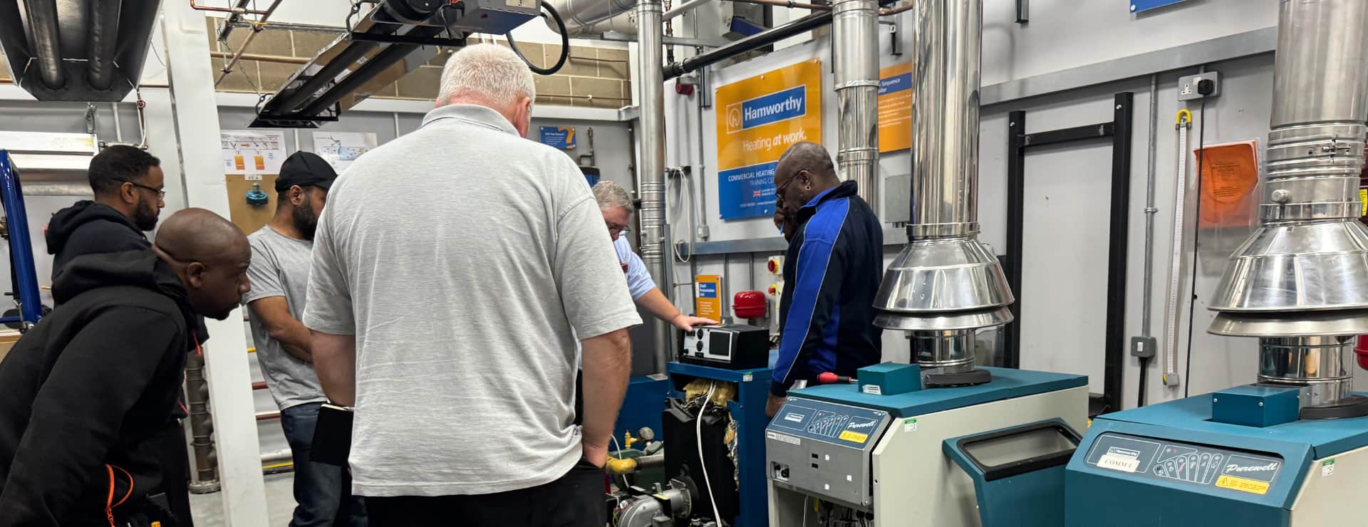 Commercial gas students in a workshop with their trainer