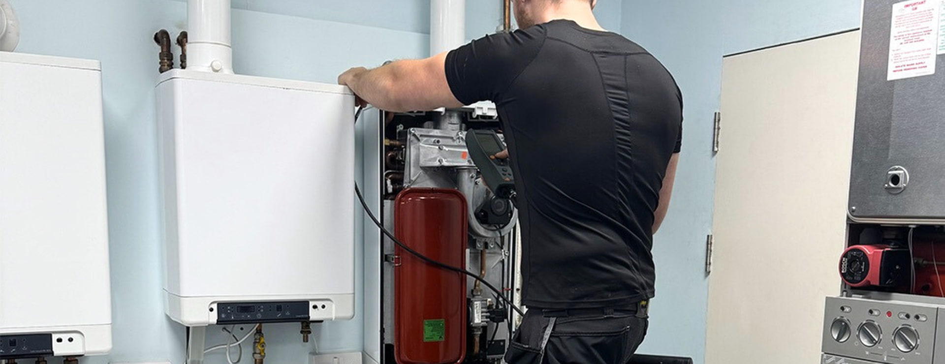 Gas engineer completing a flue test as part of their CCN1 reassessment