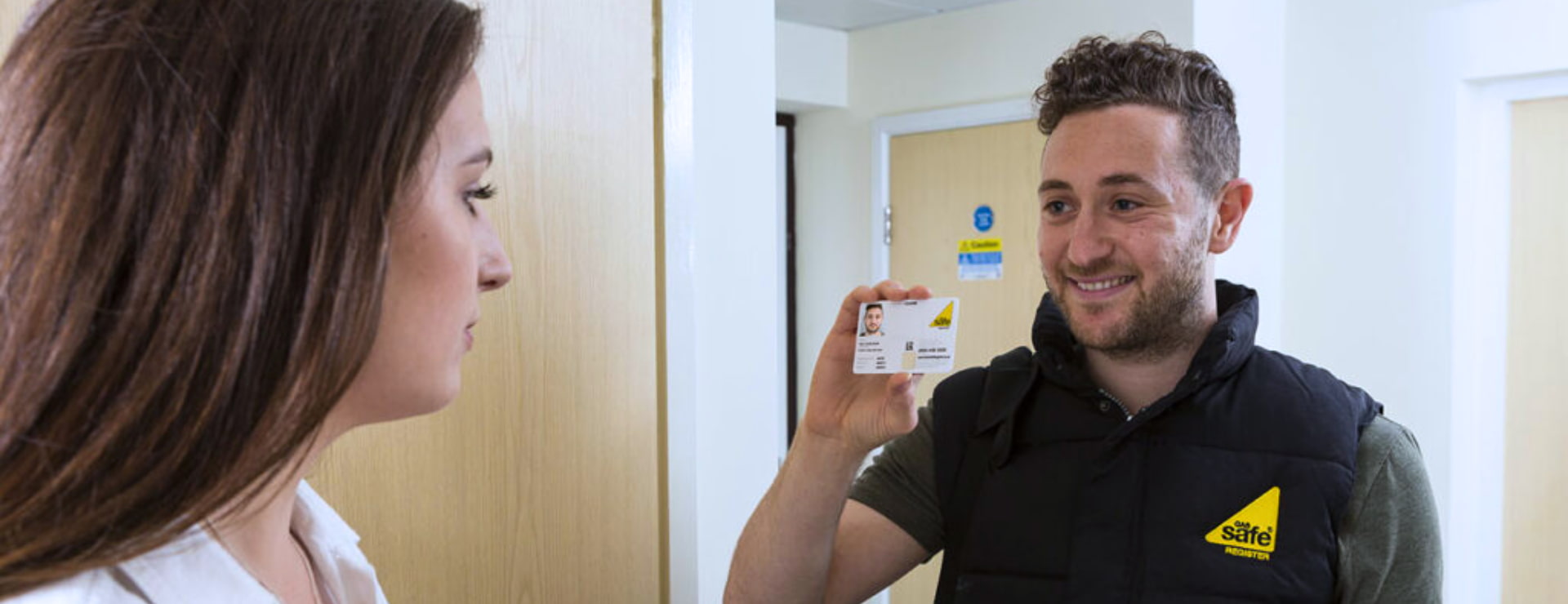 Gas engineer showing Gas Safe ID card