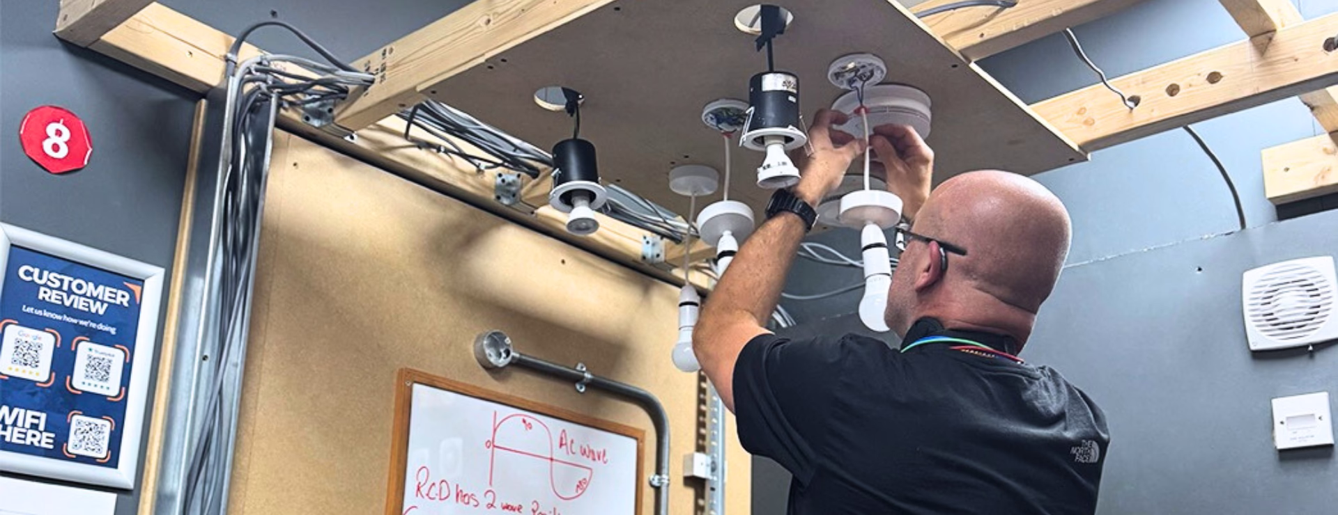 A man completing electrical training so that he can apply for an ECS gold card