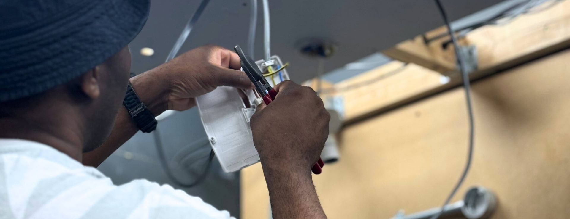 An electrician completing a job for a client