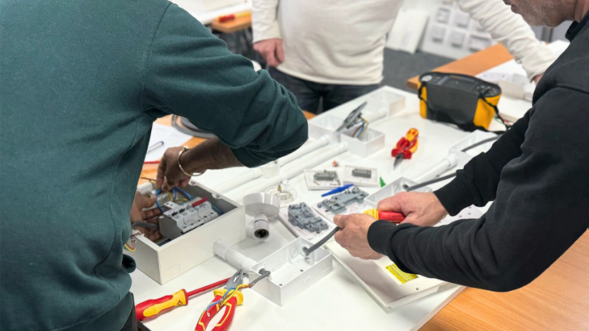 Logic4training electrical students working on mock electrical installations