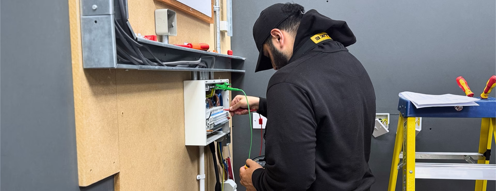 A Logic4training trainee electrician working on a consumer unit