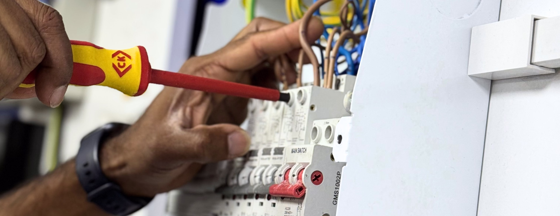 A Logic4training electrician completing their training on a test consumer unit