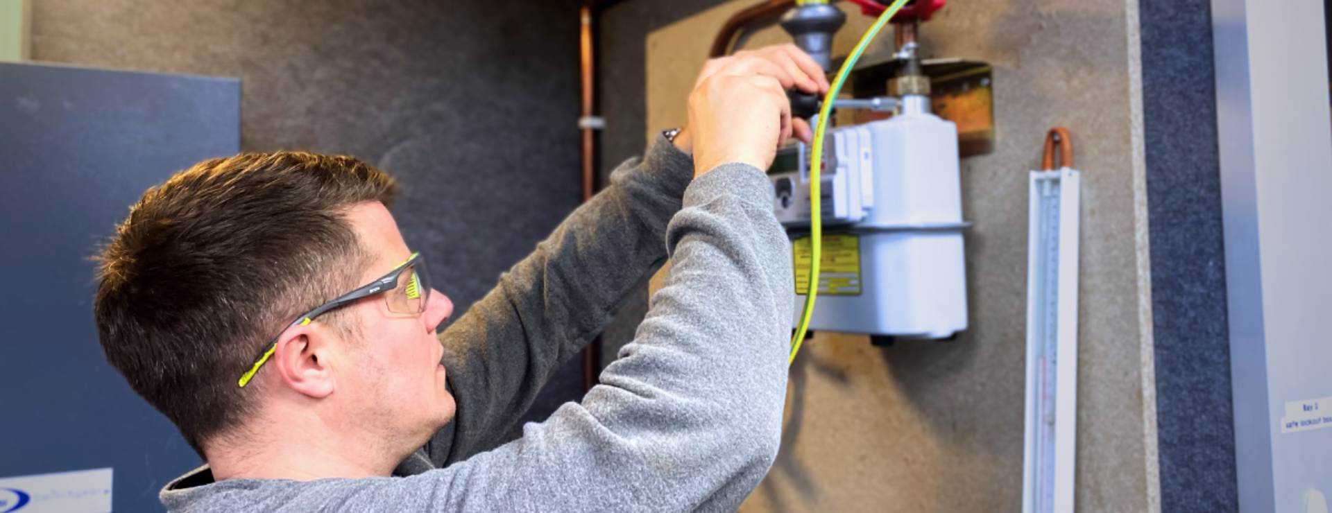 A Logic4training smart meter apprentice working on a gas meter