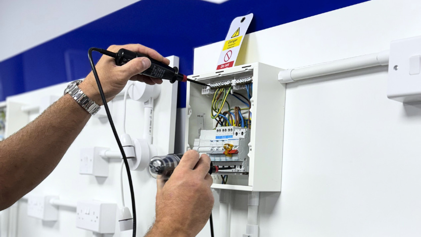 A Logic4training student performing safe electrical isolation as part of their Electrical Safety course
